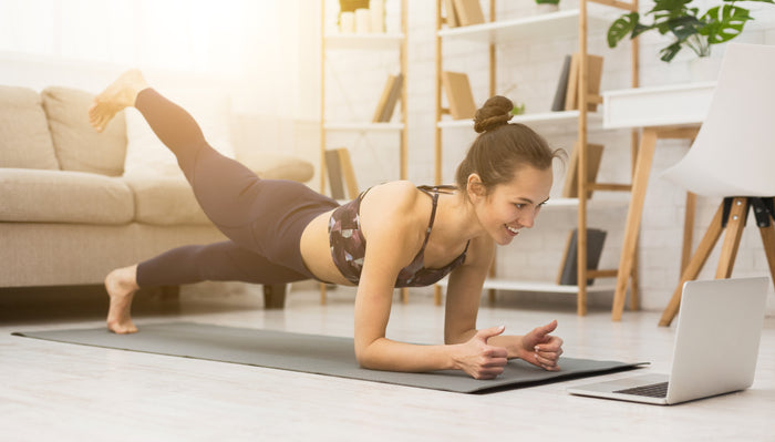 exercising-at-home-woman-doing-workout-video-at-home-on-computer-immune-system-boost
