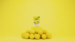 At the start of the video, a box True Lemon is at the top of a pile of fresh lemons. A woman pulls a lemon wedge out of the box, and it spins on her finger, turning into a packet of True Lemon. Text fades into focus which reads 