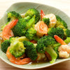A delicious bowl of steamed broccoli and shrimp, dusted in True Lemon.